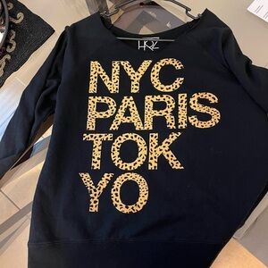 Black sweatshirt size LRG with “NYC PARIS TOKYO” front. Has a flashdance collar.